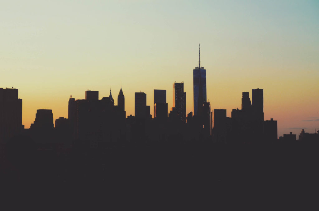 a photo of NY skyline during a sunset