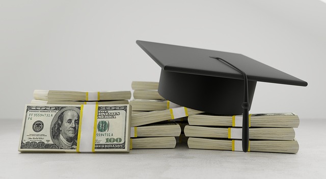 Pile of money and a graduation cap